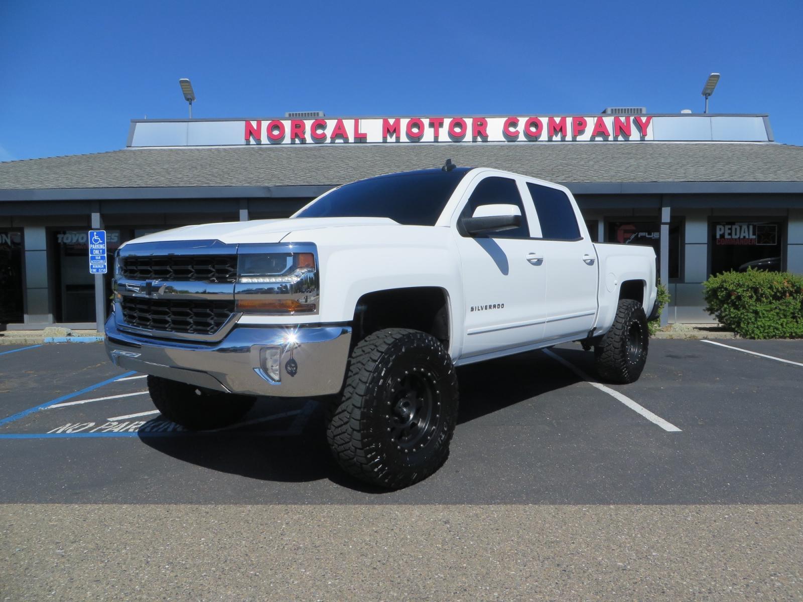 2018 White /BLACK Chevrolet Silverado 1500 LT (3GCPCREC7JG) with an 5.3L V8 OHV 16V engine, automatic transmission, located at 2630 Grass Valley Highway, Auburn, CA, 95603, (530) 508-5100, 38.937893, -121.095482 - Must see Pre Runner.... CST front lift spindals, Camburg UCA's, King Adjustable 2.5 Coil-overs, King 2.5 rear shocks, 35" Toyo RT Trail tires, 17" Method Race wheels, MZ front skid plate, G2 rear differntail cover, Full size bed mounted spare tire, Black Vinyl roof wrap, smoke tail lights and 3rd br - Photo #0